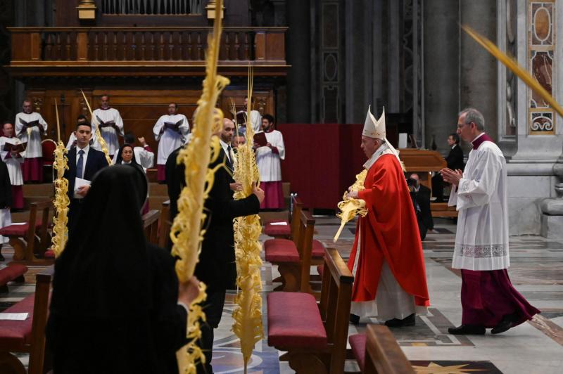 Pope celebrates Palm Sunday mass in nearly empty St. Peter's Basilica